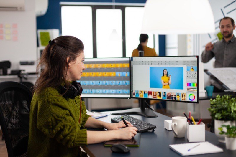 Graphic designer editing visual brand assets